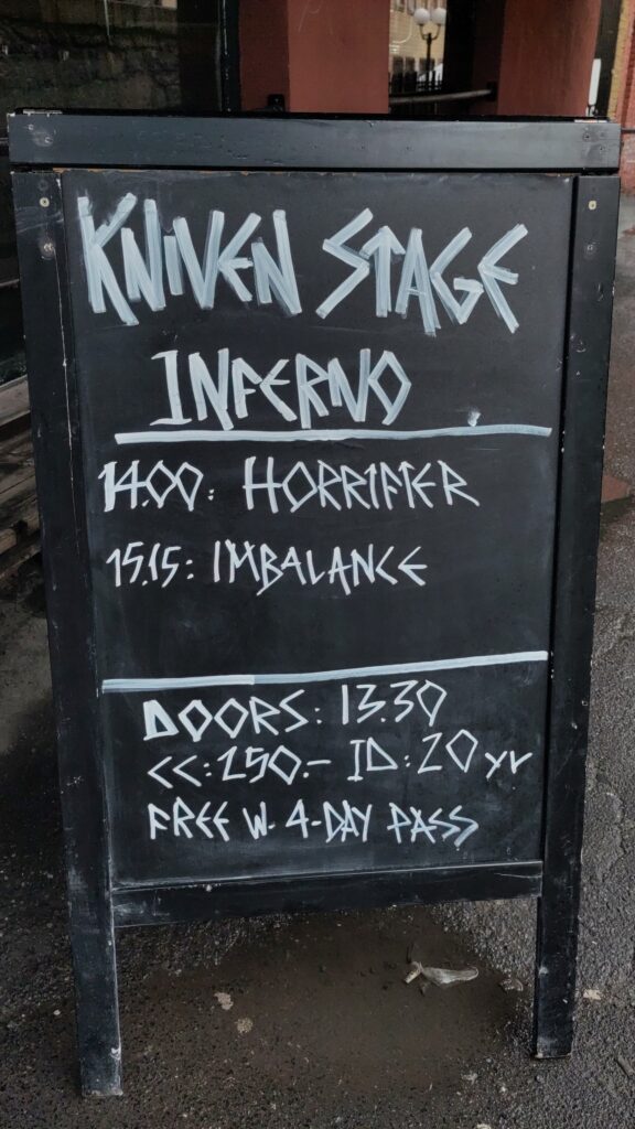 A sign announcing Horrifier and Imbalance on the Kniven stage at Inferno.